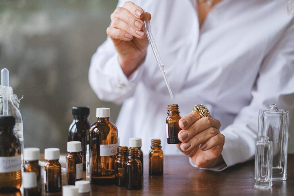 Selective Focus Photo of Dropper and Amber Bottles